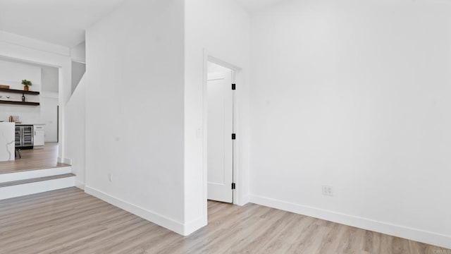 5122 Coban St, San Diego, CA 92114 - unfurnished room with beverage cooler and wood finished floors