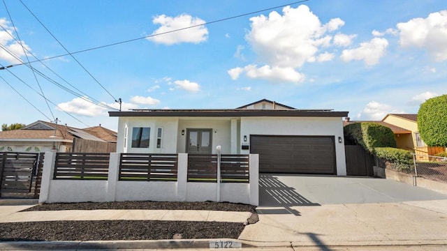 5122 Coban St, San Diego, CA 92114 - view of front of home with a garage, a fenced front yard, stucco siding, concrete driveway, and french doors