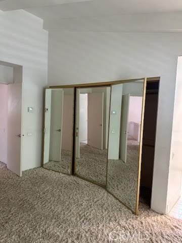 23135 Park Contessa, Calabasas, CA 91302 - unfurnished bedroom featuring carpet flooring and vaulted ceiling