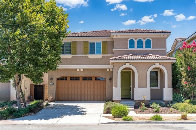 9370 Bistro Pl, Rancho Cucamonga, CA 91730 - mediterranean / spanish-style house featuring a garage, concrete driveway, stucco siding, and a tiled roof