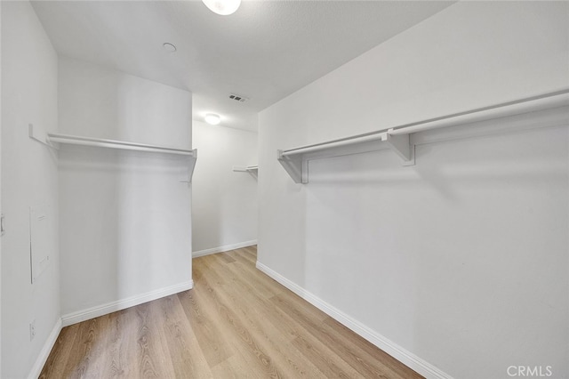 9370 Bistro Pl, Rancho Cucamonga, CA 91730 - spacious closet featuring light wood-type flooring