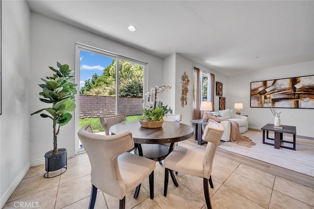 9370 Bistro Pl, Rancho Cucamonga, CA 91730 - dining area with light tile patterned floors and recessed lighting