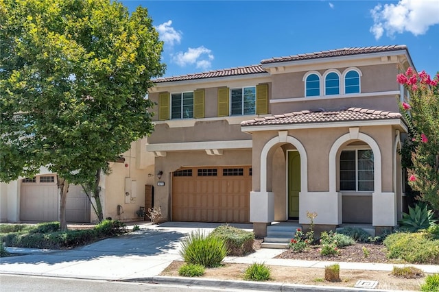 9370 Bistro Pl, Rancho Cucamonga, CA 91730 - mediterranean / spanish home with a tile roof, stucco siding, a garage, and driveway