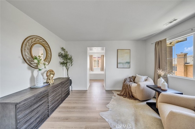9370 Bistro Pl, Rancho Cucamonga, CA 91730 - living room featuring wood finished floors and baseboards
