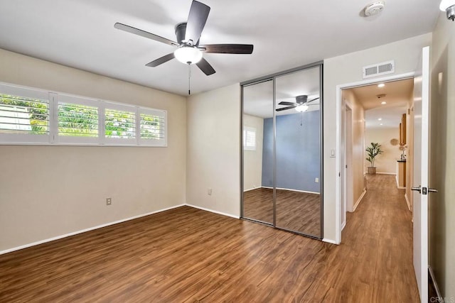 4110 Lewis St, Oceanside, CA 92056 - unfurnished bedroom with wood finished floors, a closet, and ceiling fan