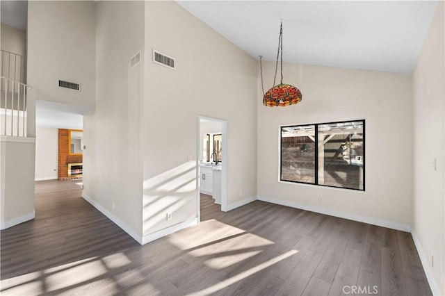 36647 Apache Plume Dr, Palmdale, CA 93550 - spare room featuring high vaulted ceiling and dark wood-style flooring