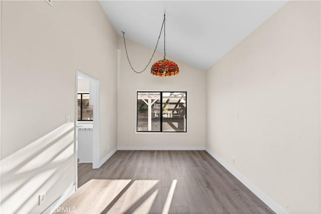 36647 Apache Plume Dr, Palmdale, CA 93550 - unfurnished dining area with wood finished floors and high vaulted ceiling