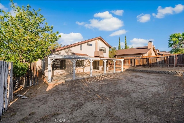 36647 Apache Plume Dr, Palmdale, CA 93550 - back of house with a patio area, a fenced backyard, and stucco siding
