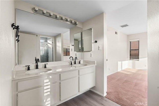 36647 Apache Plume Dr, Palmdale, CA 93550 - full bath featuring double vanity, a shower with shower door, and wood finished floors