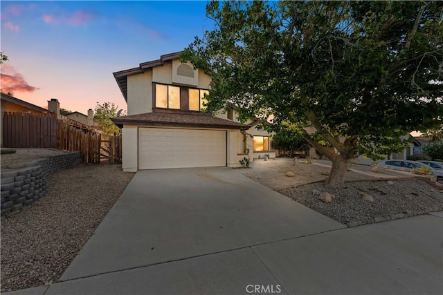 36647 Apache Plume Dr, Palmdale, CA 93550 - view of front facade with stucco siding, driveway, and a garage