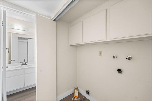 36647 Apache Plume Dr, Palmdale, CA 93550 - laundry area with cabinet space, washer hookup, hookup for a gas dryer, and wood finished floors