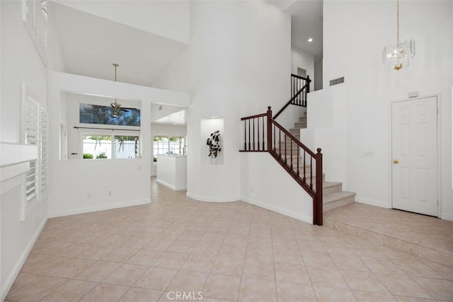 15 Havre Ct, Lake Forest, CA 92610 - foyer with a towering ceiling, a chandelier, stairway, and light tile patterned floors