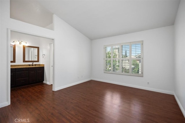 15 Havre Ct, Lake Forest, CA 92610 - unfurnished bedroom with vaulted ceiling, dark wood-style flooring, and ensuite bath