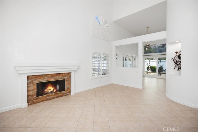 15 Havre Ct, Lake Forest, CA 92610 - unfurnished living room with high vaulted ceiling, a fireplace, a ceiling fan, and tile patterned flooring