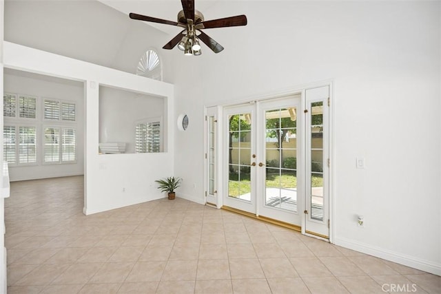 15 Havre Ct, Lake Forest, CA 92610 - empty room featuring a high ceiling, french doors, ceiling fan, and light tile patterned floors