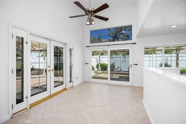 15 Havre Ct, Lake Forest, CA 92610 - unfurnished room with french doors, healthy amount of natural light, a ceiling fan, light tile patterned floors, and a towering ceiling