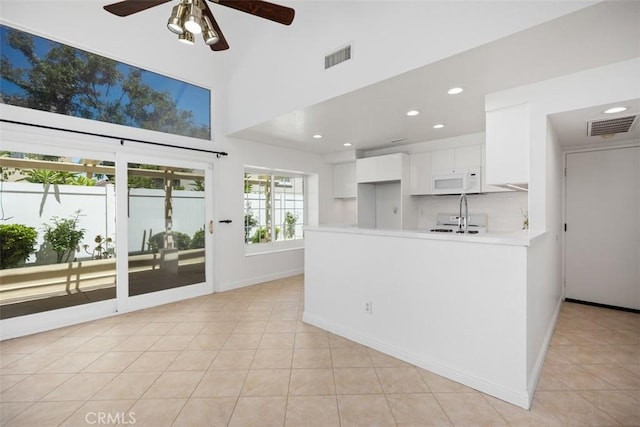 15 Havre Ct, Lake Forest, CA 92610 - kitchen with a ceiling fan, light countertops, white cabinetry, recessed lighting, and a peninsula
