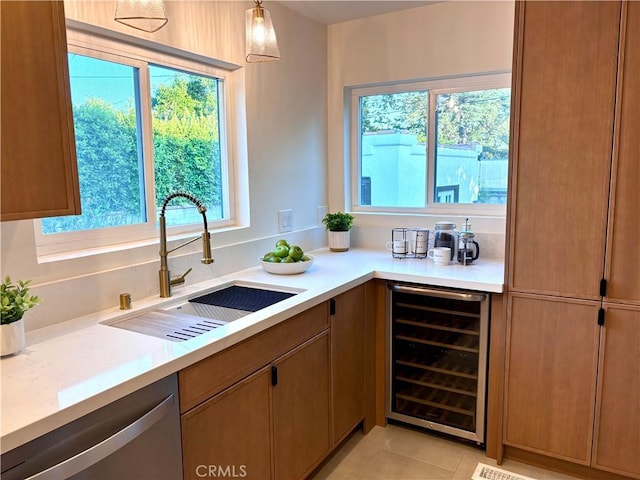 2030 Jefferson Dr, Pasadena, CA 91104 - kitchen with wine cooler, stainless steel dishwasher, and light countertops