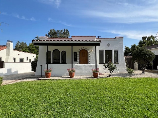 2030 Jefferson Dr, Pasadena, CA 91104 - mediterranean / spanish-style house with stucco siding, a front yard, and a tile roof