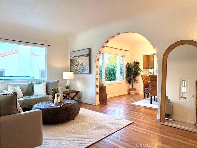 2030 Jefferson Dr, Pasadena, CA 91104 - living area with arched walkways and light wood-style flooring