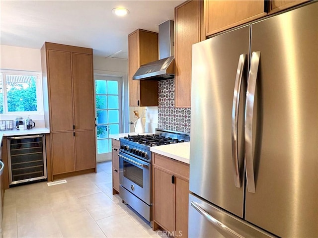 2030 Jefferson Dr, Pasadena, CA 91104 - kitchen featuring stainless steel appliances, wine cooler, wall chimney exhaust hood, backsplash, and light countertops