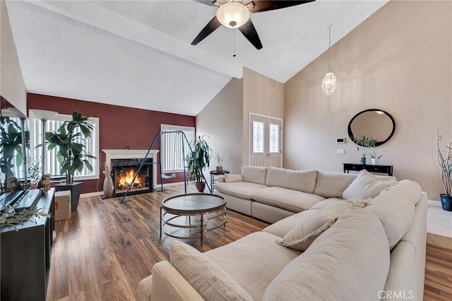 13329 Mission Tierra Way, Granada Hills, CA 91344 - living area with a ceiling fan, high vaulted ceiling, beamed ceiling, wood finished floors, and a fireplace with flush hearth