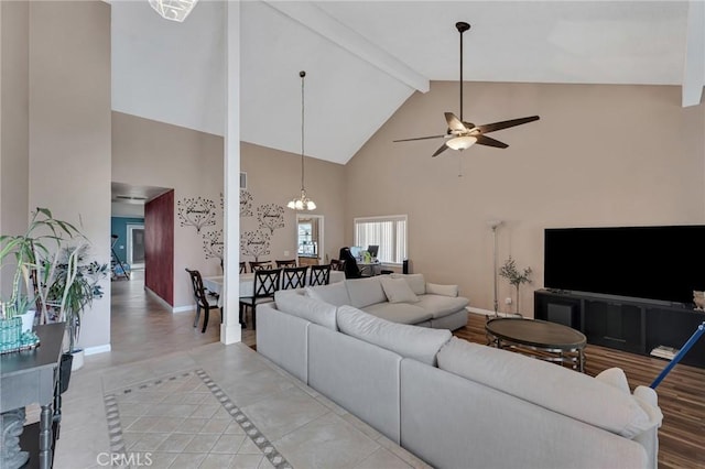 13329 Mission Tierra Way, Granada Hills, CA 91344 - living room featuring high vaulted ceiling, beam ceiling, ceiling fan, light tile patterned floors, and a chandelier