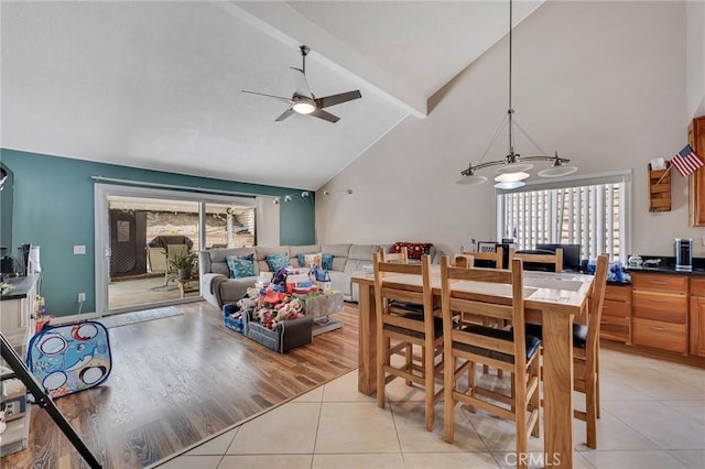 13329 Mission Tierra Way, Granada Hills, CA 91344 - dining area with high vaulted ceiling, light tile patterned floors, beam ceiling, a ceiling fan, and a chandelier