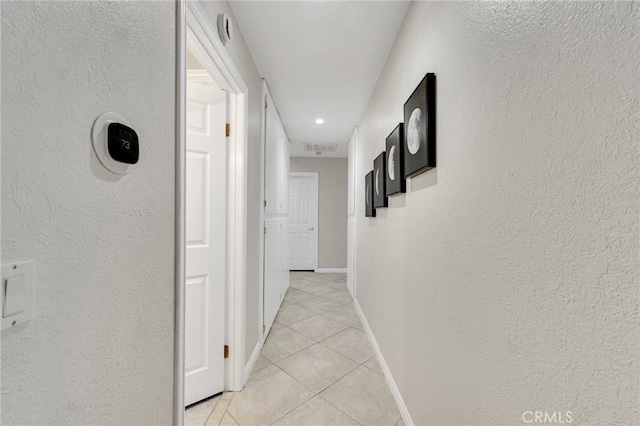 13329 Mission Tierra Way, Granada Hills, CA 91344 - hall featuring light tile patterned floors and a textured wall