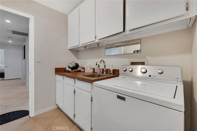 13329 Mission Tierra Way, Granada Hills, CA 91344 - laundry room featuring washer / dryer, cabinet space, light tile patterned floors, and recessed lighting