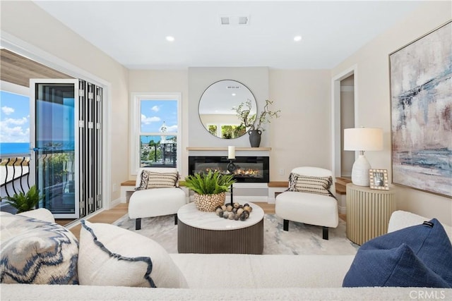2961 Rounsevel, Laguna Beach, CA 92651 - living area featuring wood finished floors, a glass covered fireplace, and recessed lighting