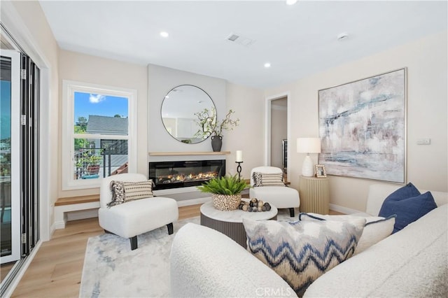 2961 Rounsevel, Laguna Beach, CA 92651 - living room with light wood finished floors, recessed lighting, and a glass covered fireplace