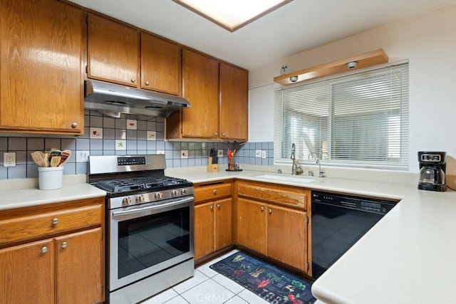 2549 Esperanza St, San Bernardino, CA 92410 - kitchen featuring gas stove, under cabinet range hood, black dishwasher, and decorative backsplash
