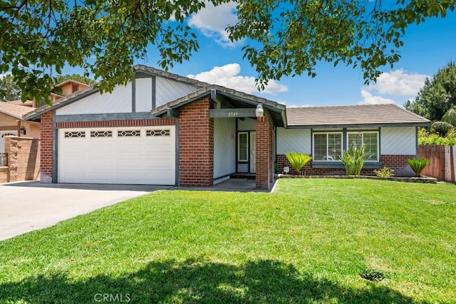 2549 Esperanza St, San Bernardino, CA 92410 - view of front facade with a garage, driveway, and brick siding