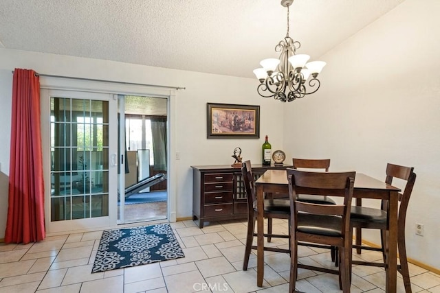 2549 Esperanza St, San Bernardino, CA 92410 - dining space with a chandelier, light tile patterned flooring, and a textured ceiling