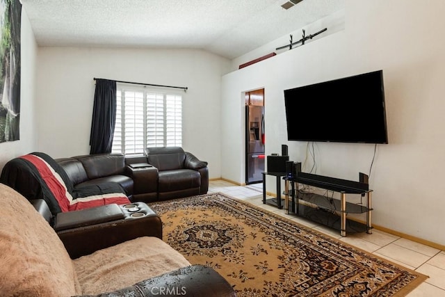 2549 Esperanza St, San Bernardino, CA 92410 - tiled living room featuring lofted ceiling and a textured ceiling