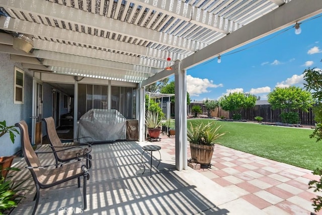 2549 Esperanza St, San Bernardino, CA 92410 - fenced backyard with a pergola, a sunroom, and a patio area