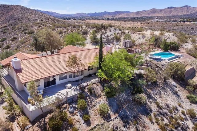 8075 Quail Trl, Yucca Valley, CA 92284 - aerial view of property and surrounding area with a mountainous background and a pool