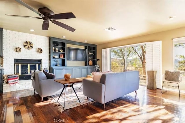 8075 Quail Trl, Yucca Valley, CA 92284 - living room featuring wood-type flooring, a ceiling fan, a fireplace, and recessed lighting
