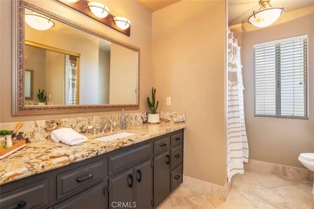 8075 Quail Trl, Yucca Valley, CA 92284 - bathroom featuring vanity, marble look tile flooring, and curtained shower