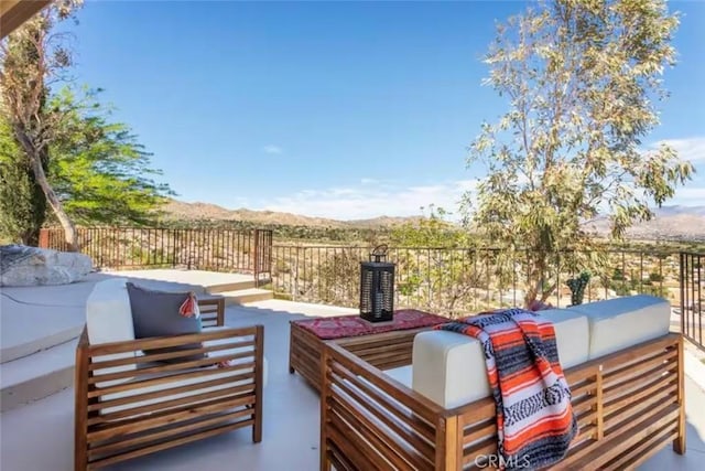 8075 Quail Trl, Yucca Valley, CA 92284 - view of patio featuring outdoor lounge area and a mountain view