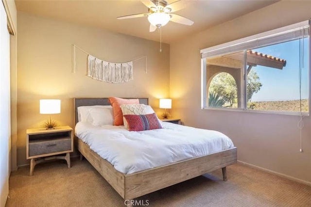 8075 Quail Trl, Yucca Valley, CA 92284 - carpeted bedroom with baseboards and ceiling fan
