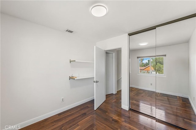 37338 Salem Ct, Palmdale, CA 93550 - unfurnished bedroom with baseboards and dark wood-style flooring