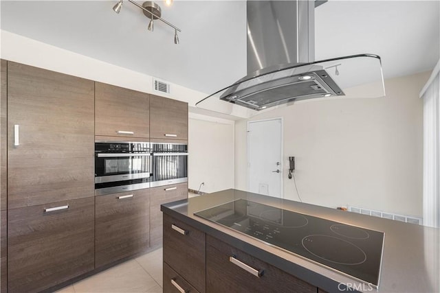 37338 Salem Ct, Palmdale, CA 93550 - kitchen with black electric cooktop, island range hood, oven, and dark countertops