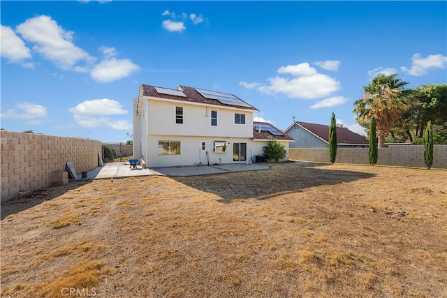 37338 Salem Ct, Palmdale, CA 93550 - back of house with a patio, a fenced backyard, solar panels, and stucco siding