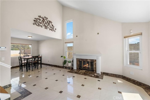 37338 Salem Ct, Palmdale, CA 93550 - living room featuring high vaulted ceiling, a high end fireplace, and tile patterned floors