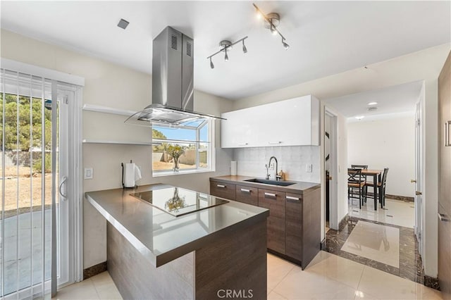 37338 Salem Ct, Palmdale, CA 93550 - kitchen featuring black electric cooktop, island range hood, white cabinetry, modern cabinets, and a kitchen breakfast bar