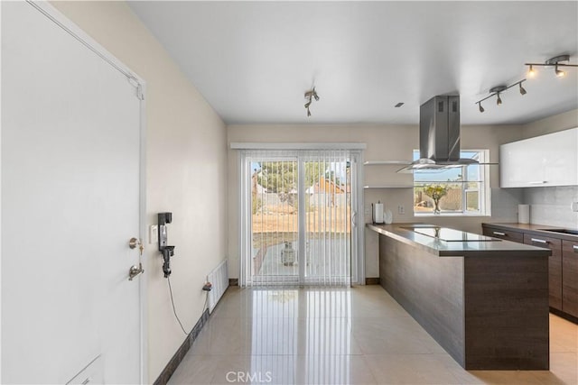 37338 Salem Ct, Palmdale, CA 93550 - kitchen with island exhaust hood, modern cabinets, black electric cooktop, a peninsula, and light tile patterned floors
