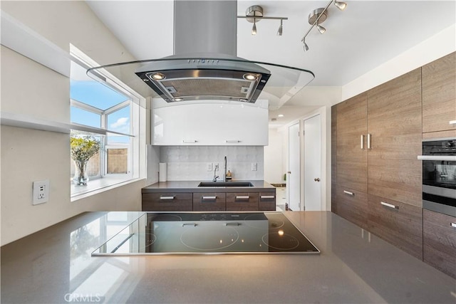 37338 Salem Ct, Palmdale, CA 93550 - kitchen with range hood, oven, black electric cooktop, decorative backsplash, and modern cabinets