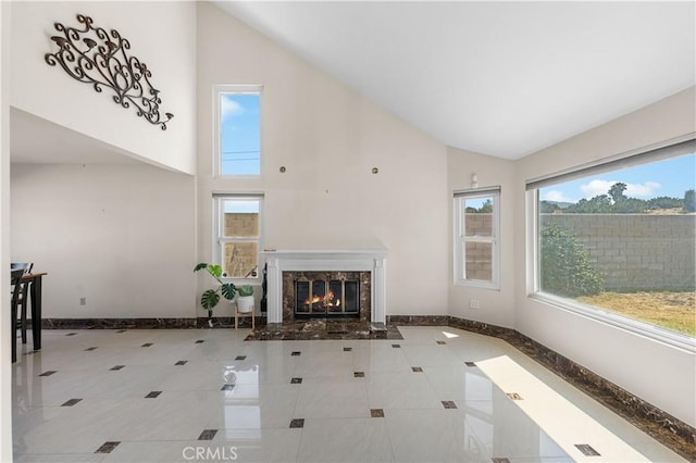 37338 Salem Ct, Palmdale, CA 93550 - unfurnished living room featuring high vaulted ceiling, a high end fireplace, and tile patterned flooring